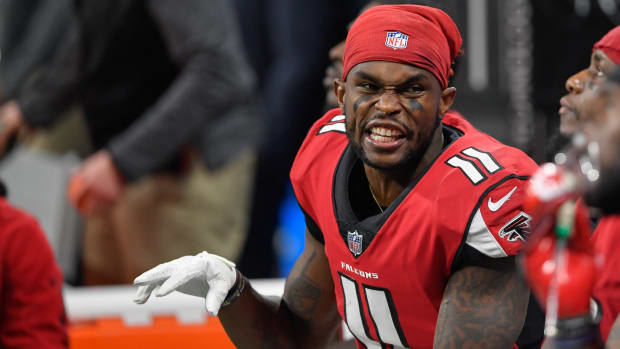 Atlanta Falcons wide receiver Julio Jones (11) reacts on the bench against the Carolina Panthers during the second half at Mercedes-Benz Stadium.